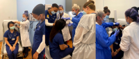 Students working with nurses.